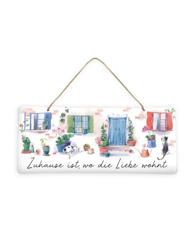 Metallschild Zeit zum Träumen vom Grätz Verlag ist mit dem Motiv einer Hausfassade bemalt. Drei bunte Fensterrahmen und eine blaue Haustüre gehören zur Fassade. Mehrere Blumentöpfe mit unterschiedlichen Blühpflanzen stehen an der Fassade. Zwei süße Katzen sind ebenso in schlafender und spielender Position zu sehen.