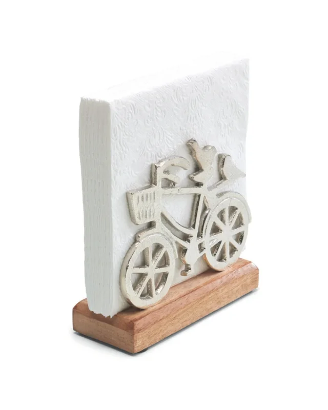 Serviettenhalter mit metallischem Fahrrad-Motiv auf hellem Holzfuß der Marke Ambiente, isoliert auf weißem Hintergrund.