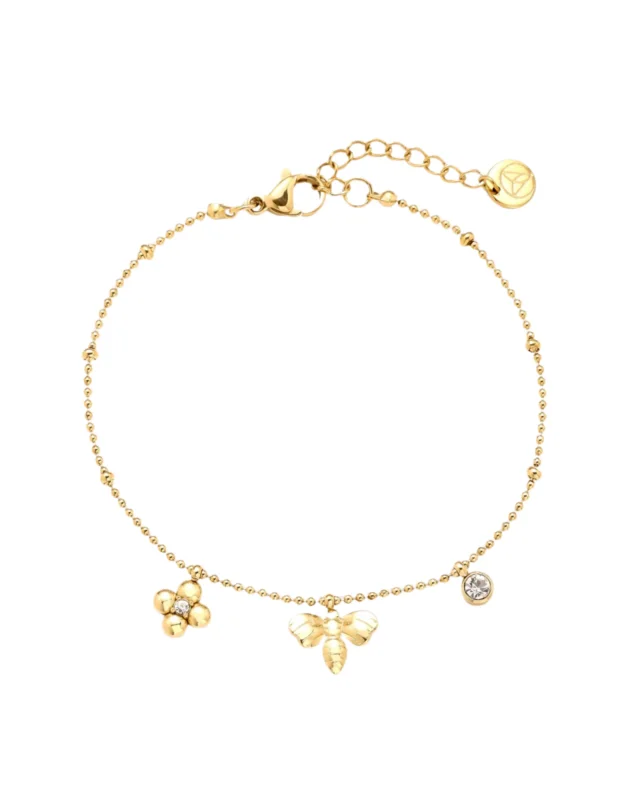 Goldenes Armband "Biene" von Dottilove vor weißen Hintergrund. Das Armband ist goldig und hat viele kleine Details wie ein Blumen und ein Bienen Anhänger.