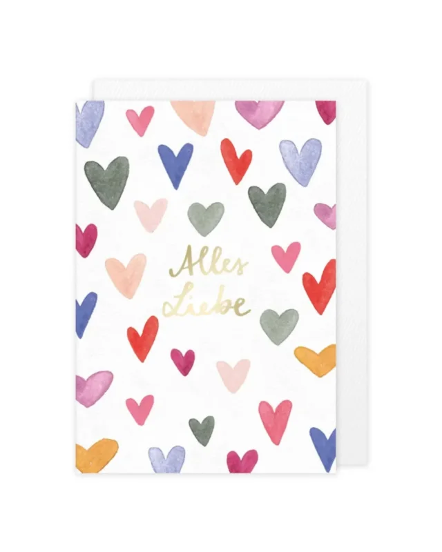 Die Grußkarte "Alles Liebe" vom Grätz Verlag ist in der Mitte mit einem goldenen "Alles Liebe" Aufdruck versehen. Designerin Lena Yokota hat den Schriftzug mit bunten Herzchen in Pastelltönen umringt.