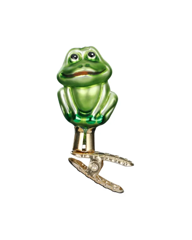 Der niedliche grüne mini Frosch zum Klemmen ist von Inge Glas in deutscher Handarbeit gefertigt. Der sitzende Frosch hat das Maul leicht geöffnet und schaut freundlich schräg nach oben.