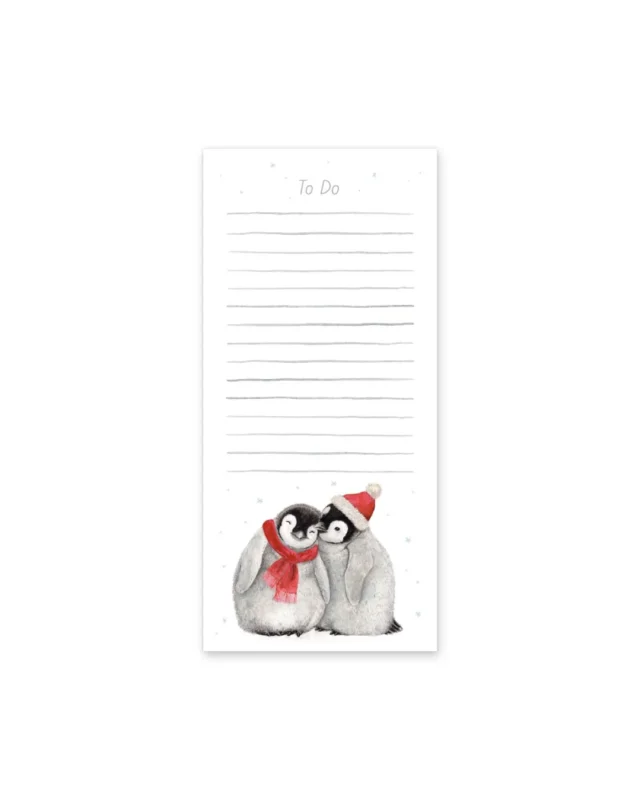 Pinguin Notizblock Christmas Penguins von Maluu in Papierbanderole, unten das winterliche Pinguinmotiv mit zwei jungen Pinguinen.