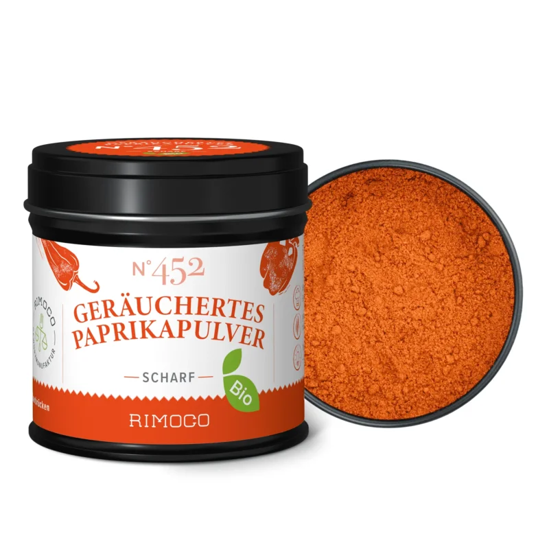 Geöffnete Dose Bio Geräuchertes Paprikapulver scharf mit leuchtend orange-rotem, gemahlenem Gewürz.