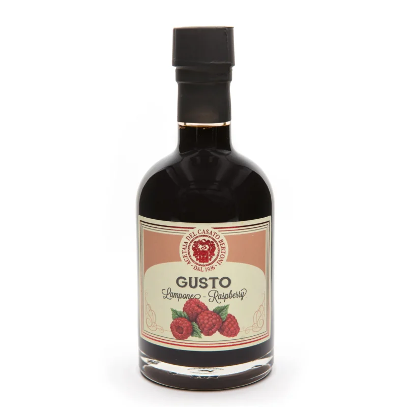 Bertoni Himbeer-Balsamico Condimento in dunkler Glasflasche mit Himbeerbild und rotem Etikett.