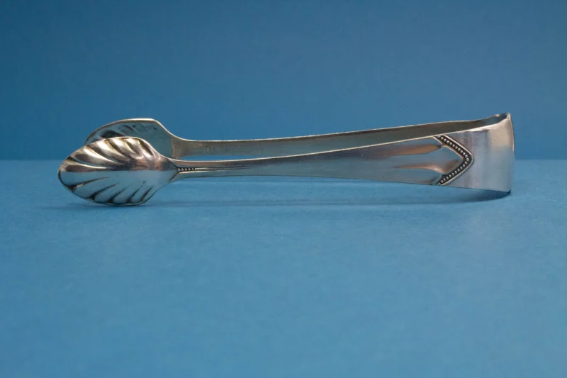 Silver plated sugar tongs with art nouveau pattern