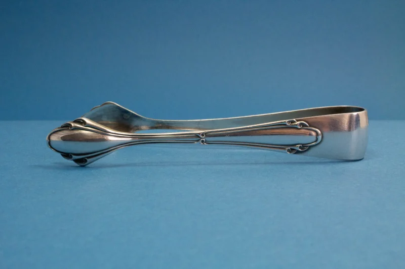 Silver plated sugar tongs with art nouveau pattern