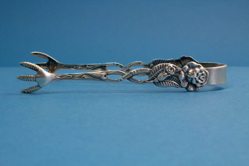 Silver plated sugar tongs with roses