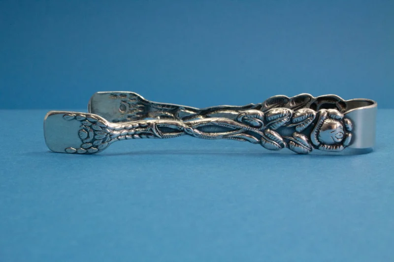 Silver plated sugar tongs with roses
